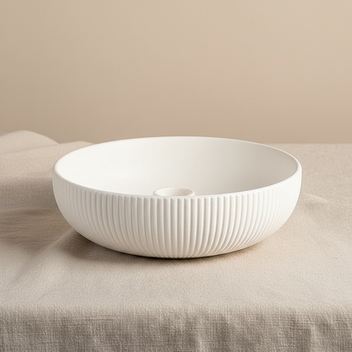 White ribbed ceramic bowl on linen fabric side view
